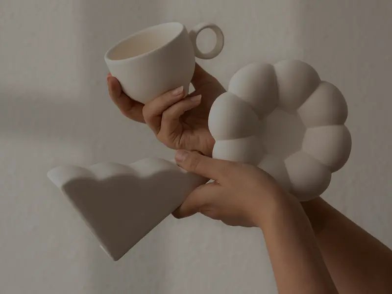 Throwing clay on the wheel at Limba Ceramics